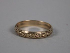 A 9ct Gold Ring with Pattern Design to Band, 2g