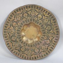 A Large Pressed Copper Wall Hanging with Islamic Floral Decoration, 75cm Diameter
