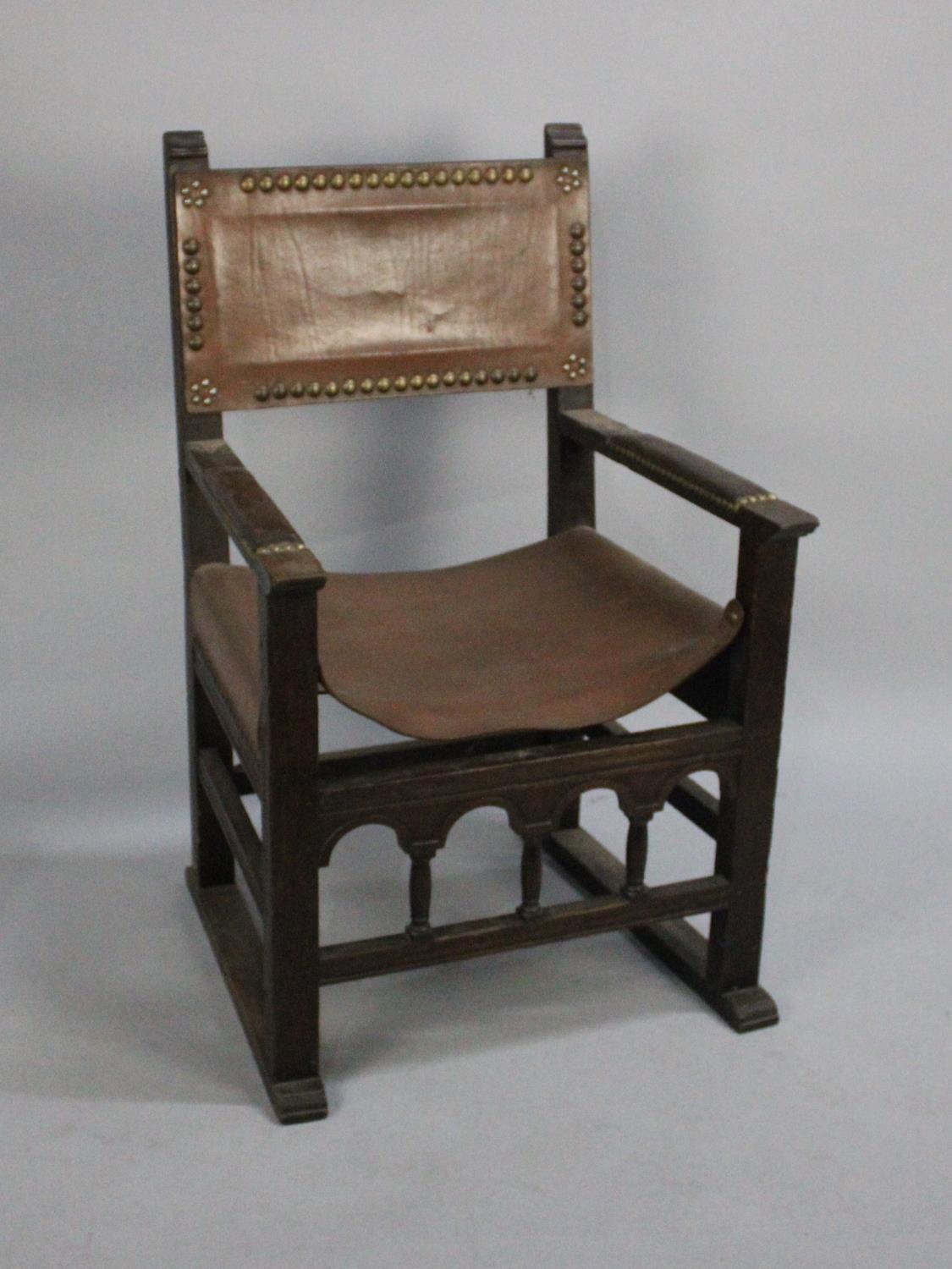 An Edwardian Oak Framed Armada Style Chair with Brass Studded Leather Arms and Back