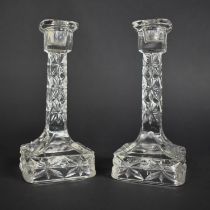 A Pair of Moulded Glass Candle Sticks on Cube Bases, 18.5cm high