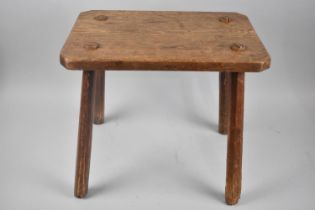 An Oak Primitive Stool with Four Staked Supports and Canted Rectangular Top, 41.5x28.5x37.5cm high
