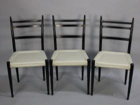 A Set of Three 1960's Ladder Back Chairs with Faux Leather Seats