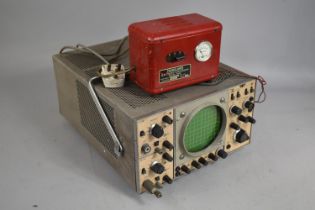 A Vintage Oscilloscope Together with a Vintage Transclamps Battery Charger