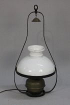 A Wrought Metal Hanging Light Fitting with Opaque Glass Shade