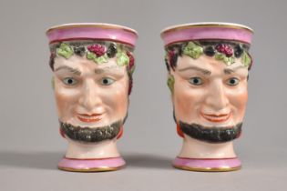 A Pair of Porcelain Bacchanalian Mask Mugs, 10cm high