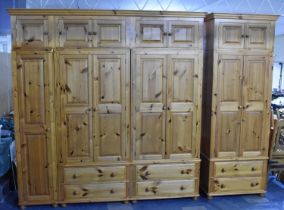 A Large Modern Pine Fitted Bedroom Unit with Hanging Sections, Four Drawers and Raised Cupboards