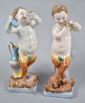 A Pair of Two 19th Century Porcelain Studies of Fauns the One with Panpipes and the Other with Wine,