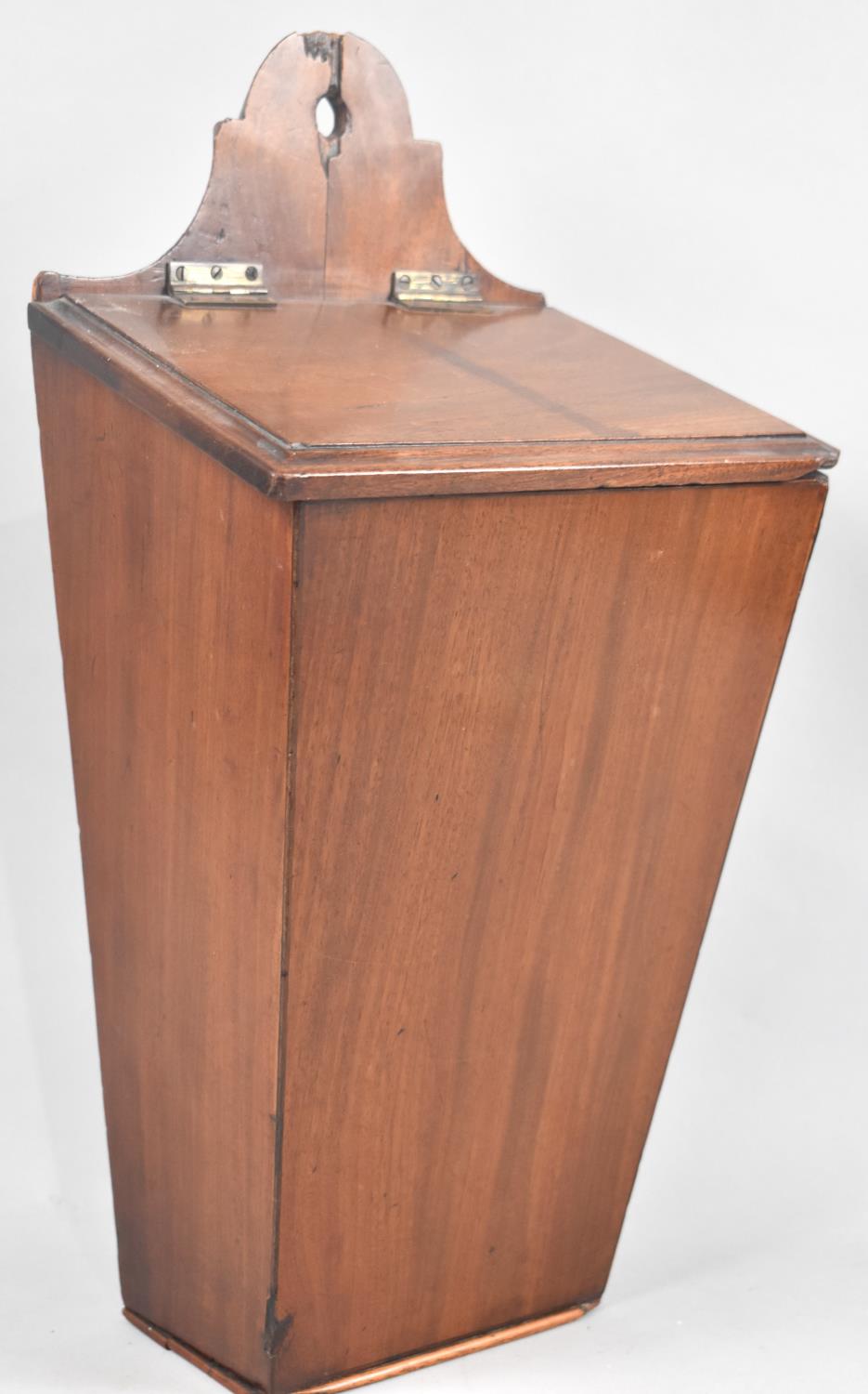 A 19th Century Mahogany Candle Box of Tapering Form with Sloping Hinged Lid, 24cms Wide and 46cms