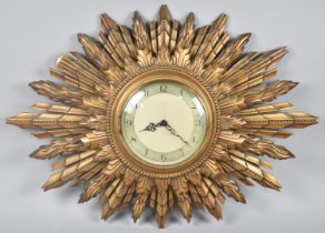 A Vintage Smiths Gilt Starburst Wall Clock, 66x49cms