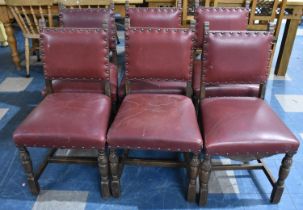 A Set of Six Edwardian Oak Framed Hide Seated Brass Studded Dining Chairs