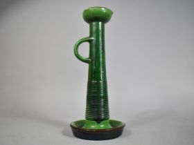 A Tall Green Glazed Terracotta Candlestick by Bretby, 35cms High