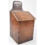 A 19th Century Oak Wall Hanging Candle Box with Hinged Sloping Lid, 20cms Wide and 40cms High