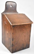A 19th Century Oak Wall Hanging Candle Box with Hinged Sloping Lid, 20cms Wide and 40cms High