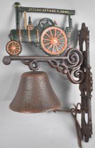 A Reproduction Cast Metal Wall Hanging Doorbell with Traction Engine Mount, 37cms High Plus VAT