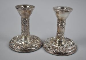 A Pair of Silver Squat Candlesticks with Relief Decoration, Matching Lot 14, 8.5cms Diameter and 9.