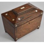 A 19th Century Rosewood Two Division Tea Caddy of Sarcophagus Form with Mother of Pearl Disc and