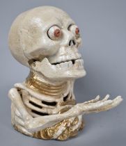 A Reproduction Cast Metal American Style Novelty Money Bank In the Form of a Skeleton, Working