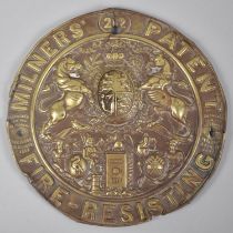 A Circular Pressed Brass Label For Milners Safe, 20cms Diameter