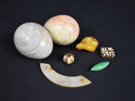 A Small Collection of Various Items to Comprise Chinese Jade Items, Polished Stone Eggs, Amber