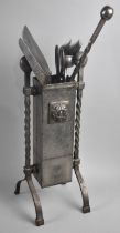 A Matching Oxidized Metal Fire Companion Set with Barley Twist Supports and Range of Tools
