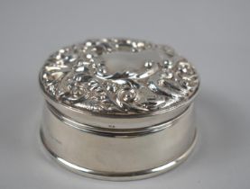 A Silver Circular Dressing Table Jewellery Box with Hinged Lid having Relief Foliate Decoration, 8.