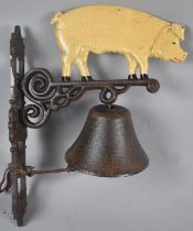 A Reproduction Cast Metal Wall Hanging Doorbell in the Form of a Pig, 33cms High Plus VAT