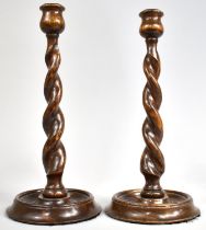 A Pair of Oak Barley Twist Candlesticks, 31cms High