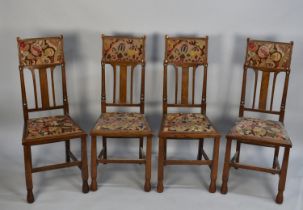 A Set of Four Edwardian Oak Dining Chairs with Tapestry Top Rails and Matching Seats