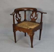 A 19th Century Oak Framed Corner Armchair with Rush Seat