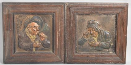 A Pair of Hand Coloured Cast Iron Relief Plaques Depicting Snuff Taker and Pipe Smoker, Eah Set in