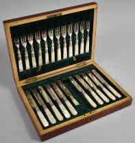 An Edwardian Mahogany Canteen Containing 12 Mother of Pearl Handled Fruit Knives and Forks, One
