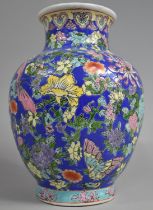 A Late 20th Century Chinese Porcelain Enamel Vase Decorated in Polychrome Enamels with Foliage and