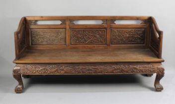 A Chinese Carved Hardwood Settle with Carved and Pierced Panel Back with Birds in Branches