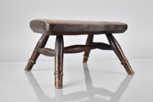 A Small 19th Century Rustic Rectangular Elm Topped Stool with Splayed Turned Supports, 25x17x15.