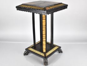 A 19th Century Ceylonese Ebony Table with A Specimen Wood Top, Over Four Legs and Platform Base with