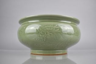 A Chinese Celadon Glaze Censer with Underglaze Dragon Chasing Flaming Pearl, with Lipped Rim and