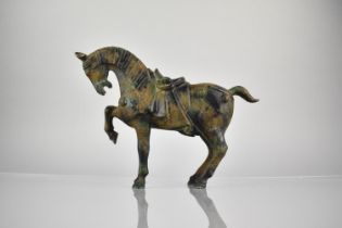 A Chinese Tang Style Cast Patinated Bronze Study of a War Horse, 21cm High