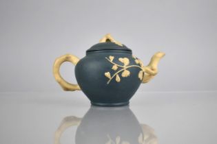 A Chinese Yixing Blue Ground Teapot with Biscuit Stylised Blossoming Branches Handle, Finial and