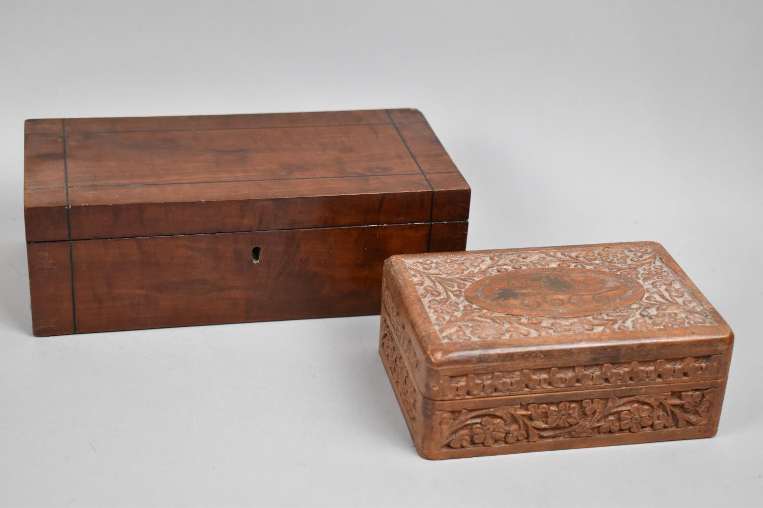 A Rectangular Mahogany Box and a Carved Brass Inlaid Cigarette Box