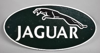A Reproduction Cast Metal Oval Sign for Jaguar, 35cms Long