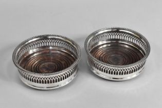 A Pair of Silver Plated Bottle Coasters with Pierced Borders, 15cms Diameter