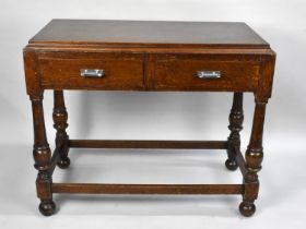 An Art Deco Oak Side Table With Two Drawers and Turned Supports, 92cms Wide