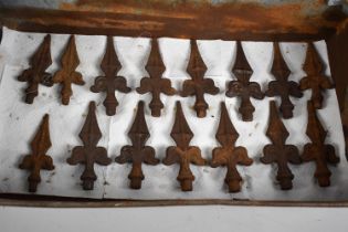 A Galvanised Tool Tray Containing 15 Cast Iron Fleur de Lys Fence or Wall Finials, Each 15cm High