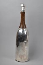 A Novelty Cocktail Shaker in the Form of a Silver Plated Champagne Bottle, 37cm High