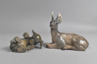 A Royal Copenhagen Recumbent Deer (756) and a Puppy (1408)