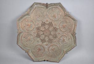 A Copper Wall Hanging Islamic Charger with Relief and Pierced Decoration