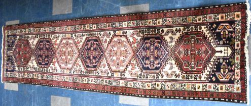 A Persian Patterned Woollen Runner, 290x74cms