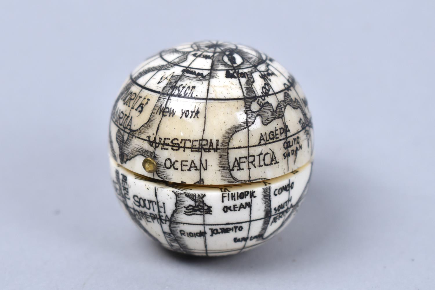A Reproduction Scrimshaw Style Combination Globe, Compass and Sundial, 3.75cms Diameter - Image 2 of 2