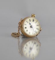 A Gold Coloured Metal Cased Antique Ball Watch, Chain Stamped for 15 Carat Gold, White Enamelled