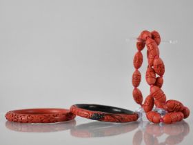 A Collection of Vintage Cinnabar Lacquer Jewellery, Two Bangles and a Necklace, One Bangle with